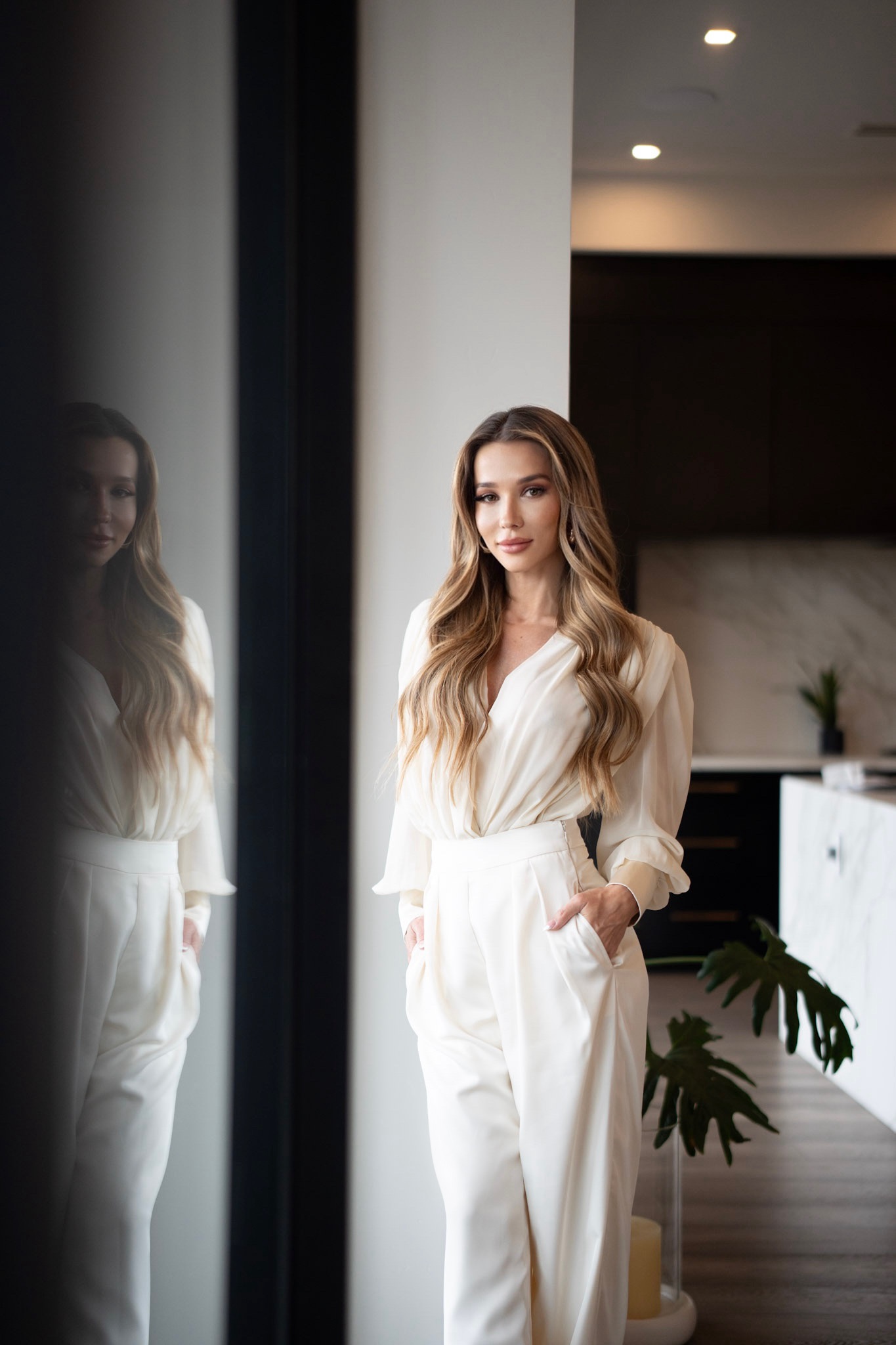 Erna Palic standing in a modern home