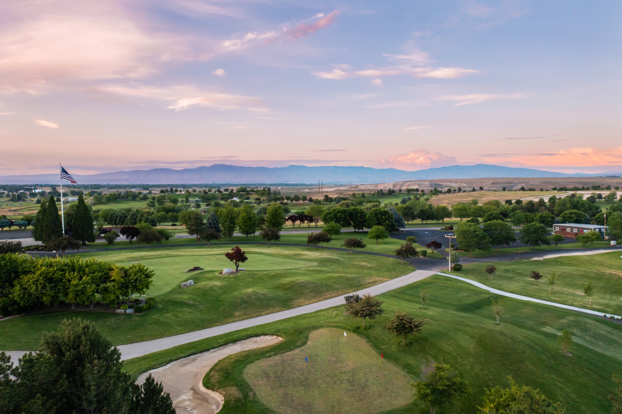 Green fairways and a distant mountain horizon at Valor in Kuna, Idaho