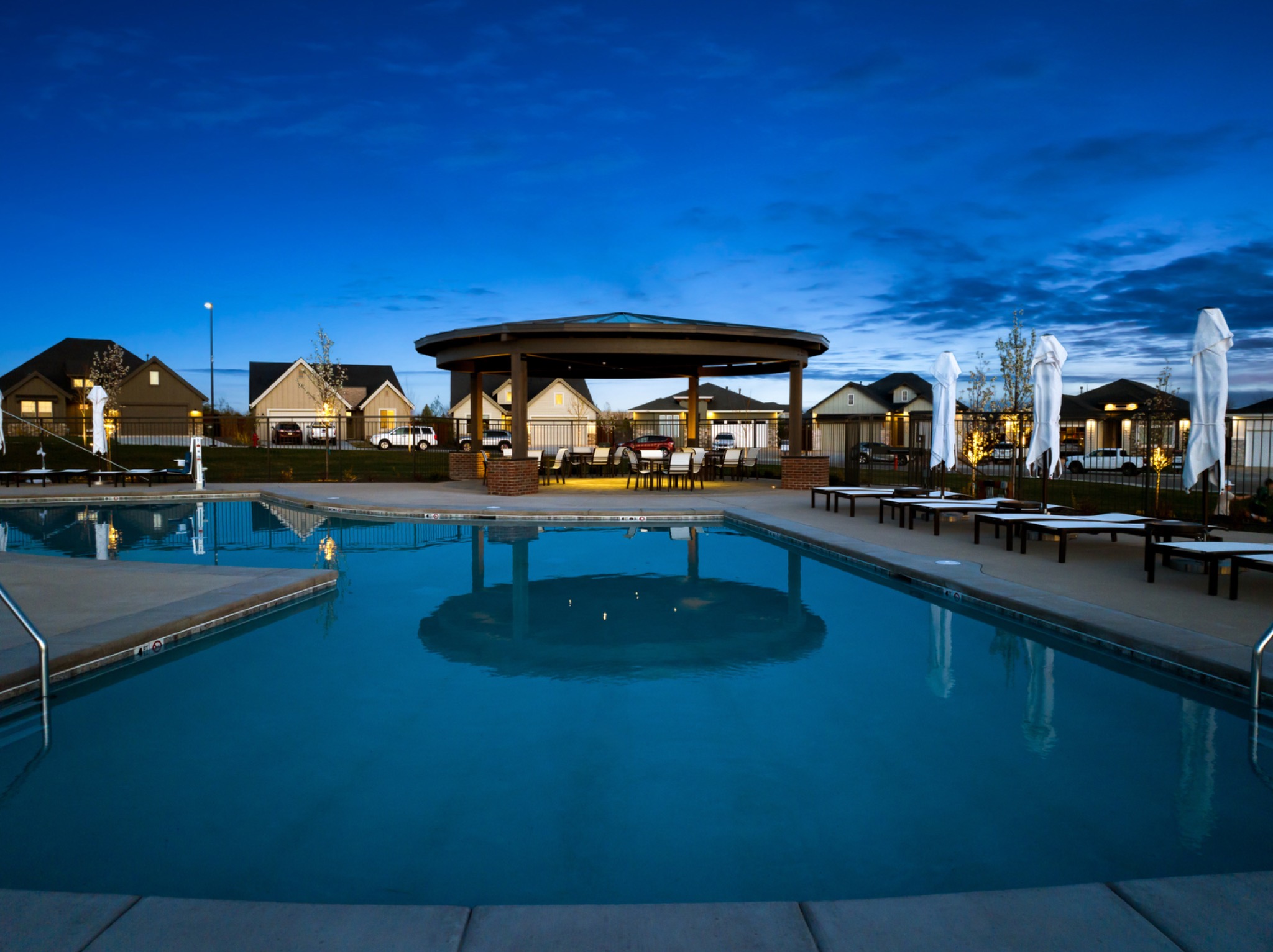 Community pool at dusk in Valor, Kuna